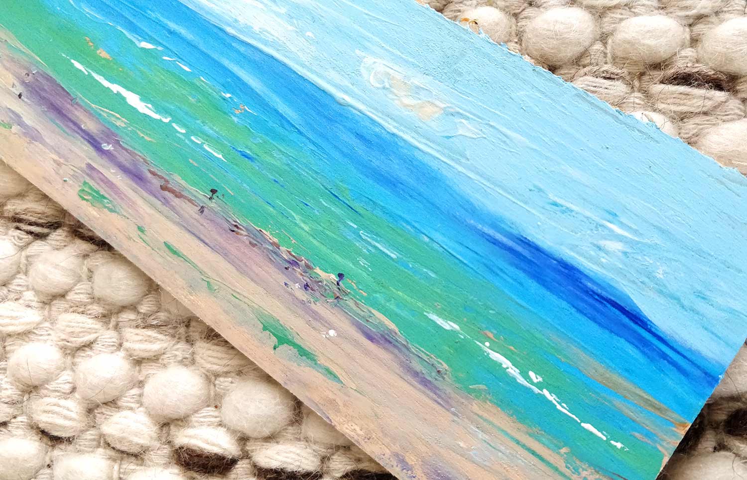 A beach scene painted in acrylic