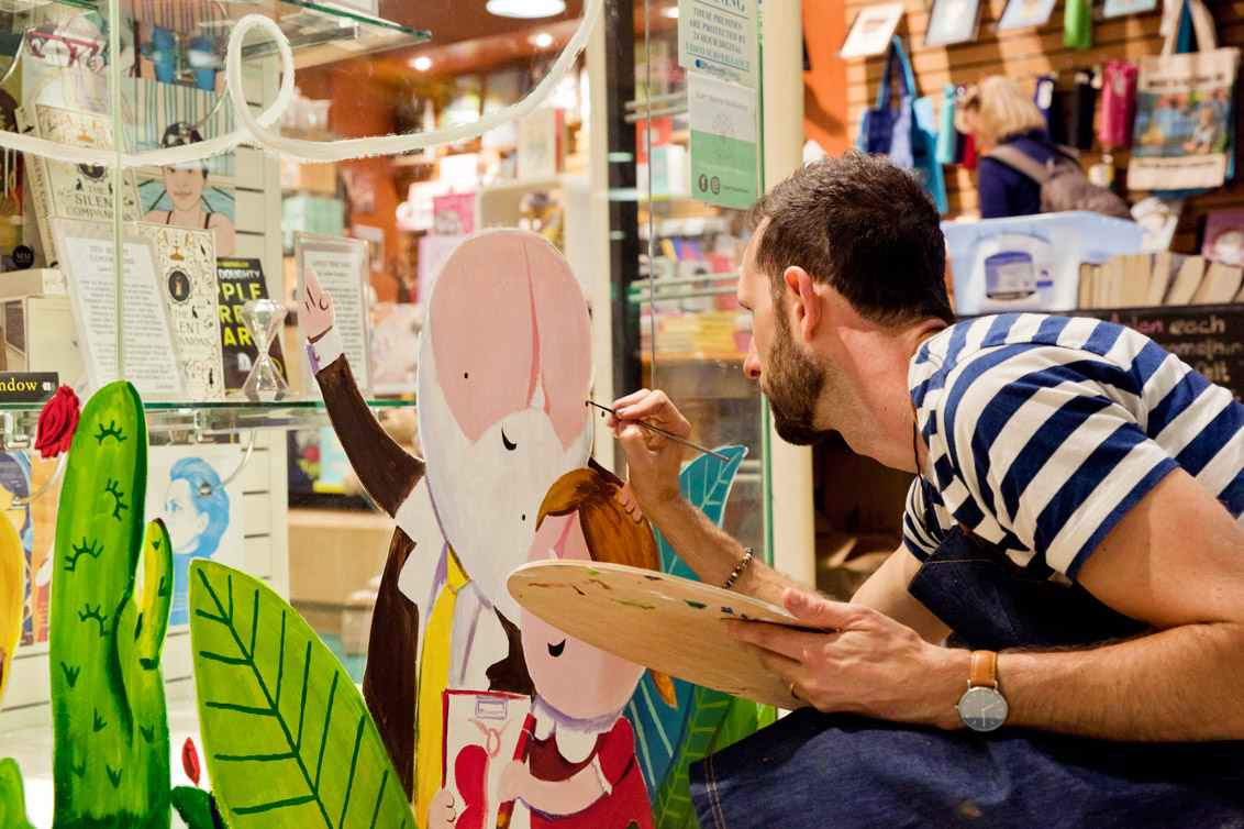 Matt Shanks painting a mural